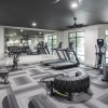 fitness center with all kinds of work out equipment overlooking the pool at broadstone amarra apts