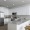 kitchen with ample counter-space, modern appliances and bright lighting